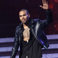chris-brown-accepts-the-award-for-best-r-b-album-for-f-a-m-e-at