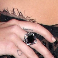 miley-cyrus-karma-finger-tattoo-300x300