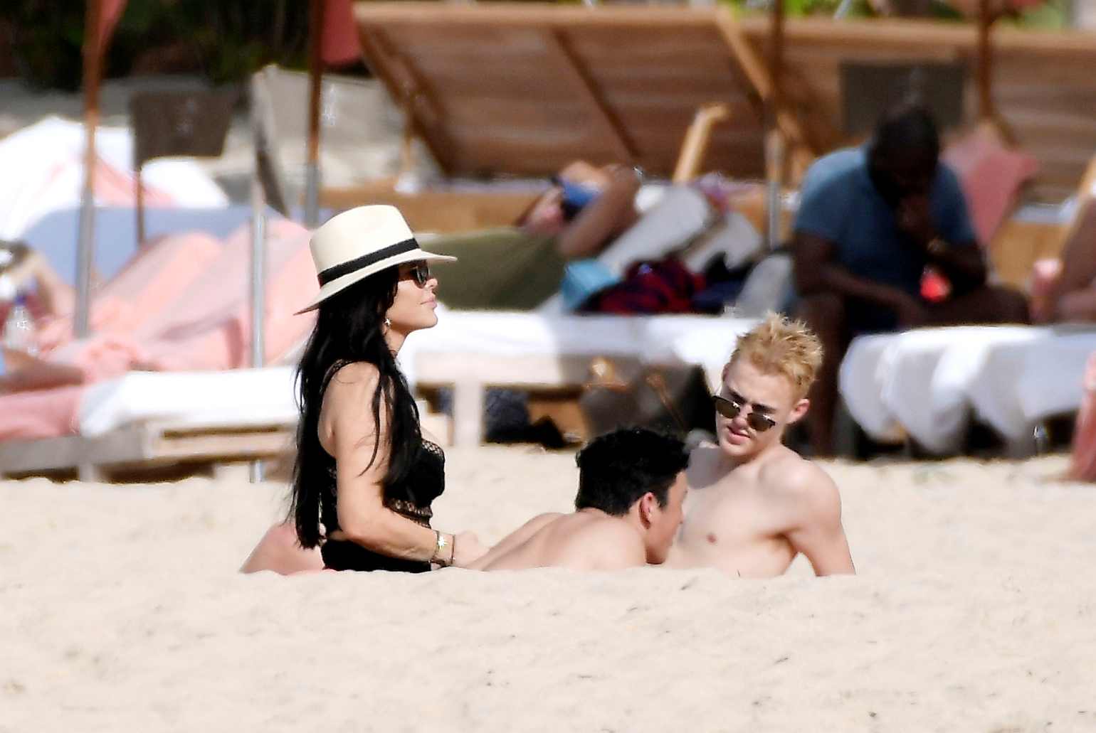 Lauren Sanchez seen enjoying the sun on the beach with her children Evan Whitesell and Niko Whitesell