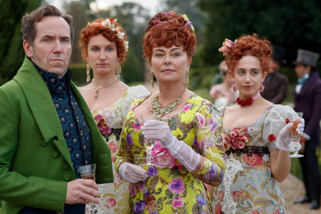Ben Miller as Lord Featherington, Bessie Carter as Prudence Featherington, Polly Walker as Portia Featherington, Harriet Cains as Phillipa Featherington.